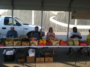 Volunteers help local farmers sell their product