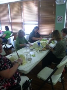 Participants slice their cabbage for sauerkraut!