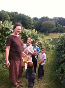 Heather and her family enjoying the harvest.