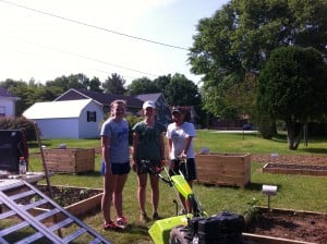 Hannah, Laura, and Kathryn with their tiller, Alice, at the Barbourville Community Garden. 