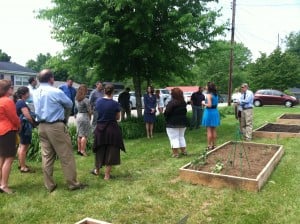 Kathryn Engle talks about the Grow Appalachia program in Knox County while showing the Barbourville Community Garden to the ARC tour group.