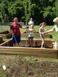 Jayden and Tim Bartram working in their gardens.