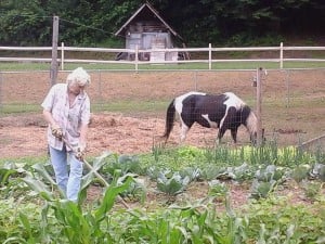 Lilly Church working in her garden.