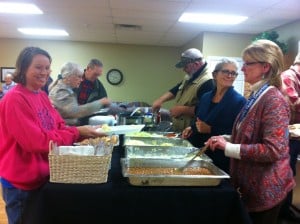 The market committee serving food. 