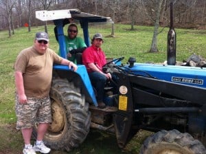 Eric, Ryan, and Kevin with a newly donated tractor for PVVTP.