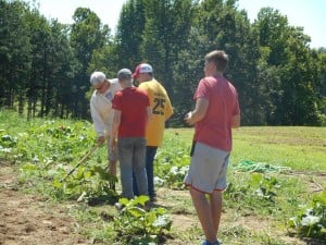 Experienced gardeners were there on Saturday to help guide the young men!