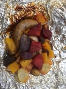 Cooked and ready to eat.  Local sausage surrounded by our homegrown veggies.  This was our best ever Hobo dinners.  We were so amazed at the colors too.  