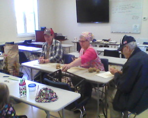 Part of our potato cutting team the day before planting.