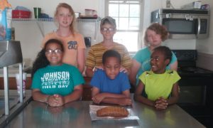 LCAAHC Youth learning to make Zucchini Bread