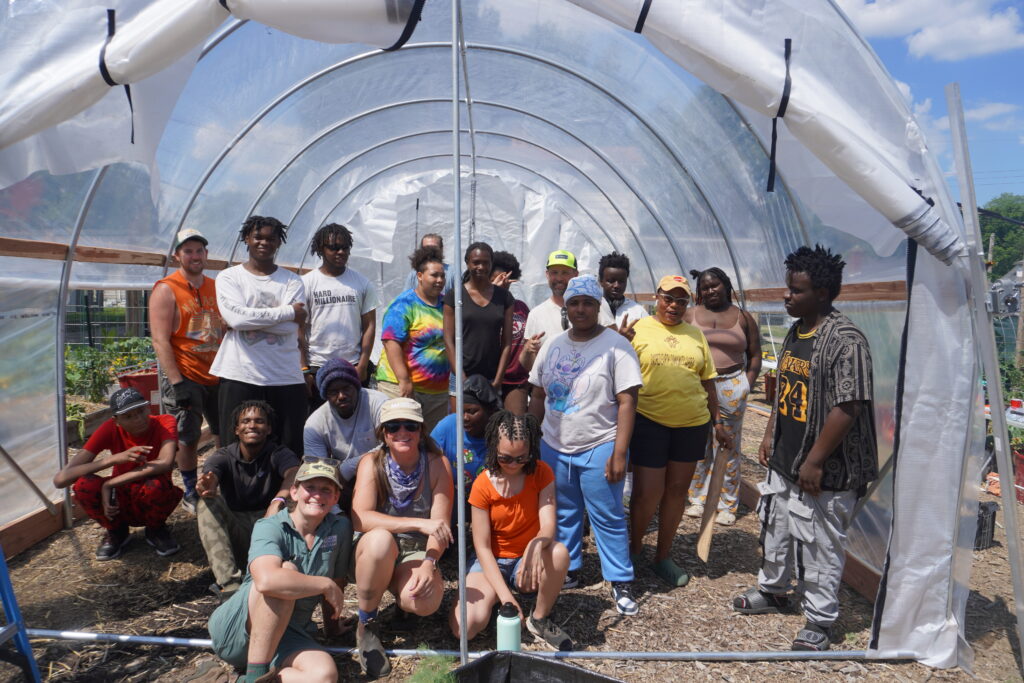 sacred earth community garden high tunnel