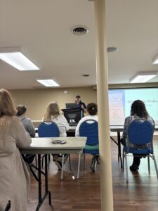 A grow ppalachia Coordinator teaching a class about gardening.