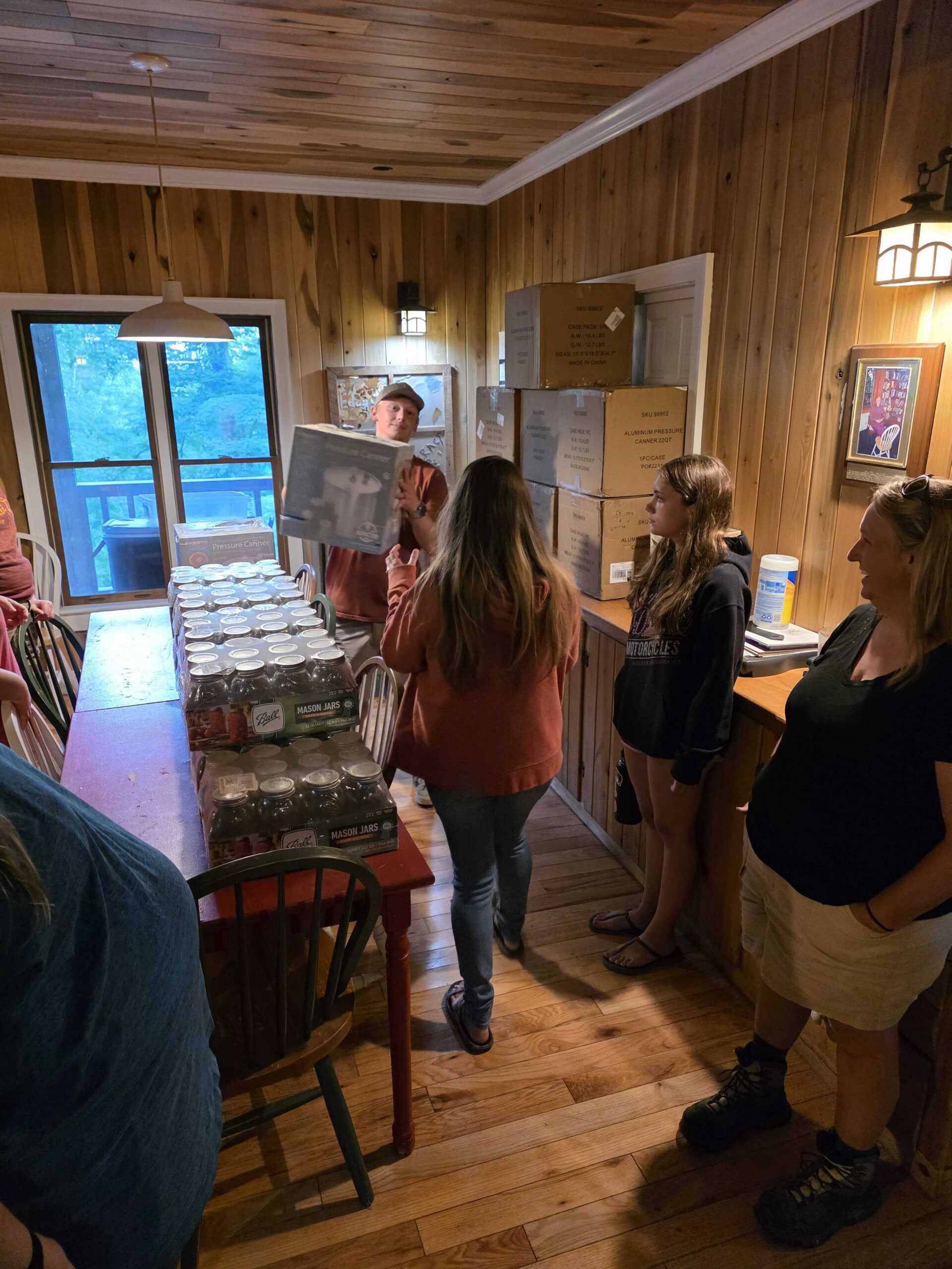Participants getting pressure canner and jars for preserving at home.